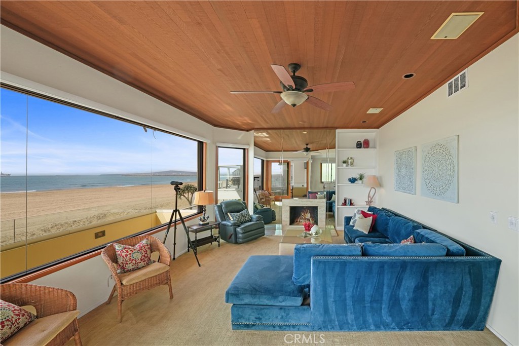 72-B Surfside Avenue Surfside, CA 90743 - Photo 24 of 56 a living room with furniture and a large window