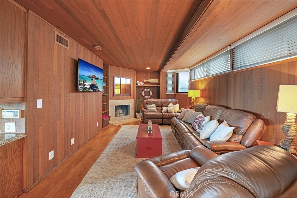 72-B Surfside Avenue Surfside, CA 90743 - Photo 31 of 56 a living room with furniture and a flat screen tv