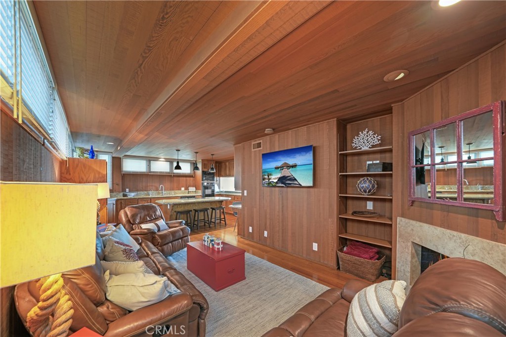 72-B Surfside Avenue Surfside, CA 90743 - Photo 32 of 56 a living room with furniture and a flat screen tv