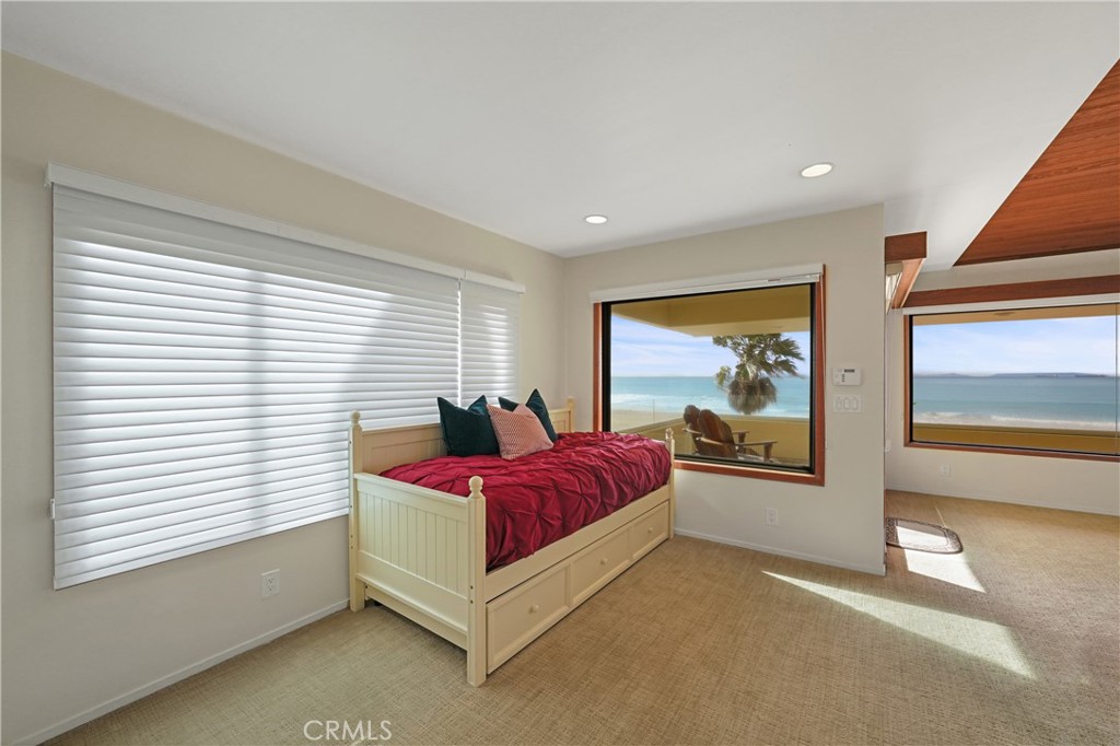 72-B Surfside Avenue Surfside, CA 90743 - Photo 35 of 56 a spacious bedroom with a bed and a large window