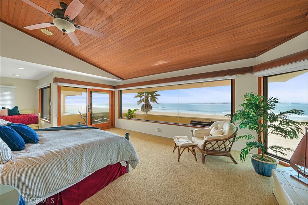 72-B Surfside Avenue Surfside, CA 90743 - Photo 39 of 56 a spacious bedroom with a balcony a bed and a couch
