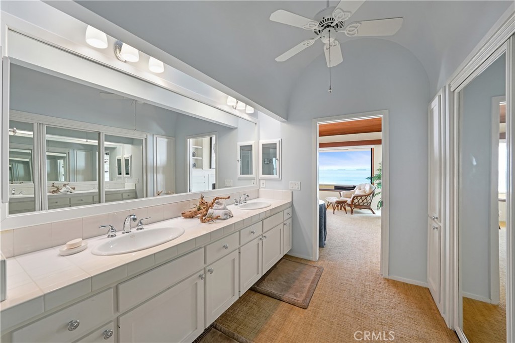 72-B Surfside Avenue Surfside, CA 90743 - Photo 42 of 56 a en suite bathroom with double vanity a sink and a mirror