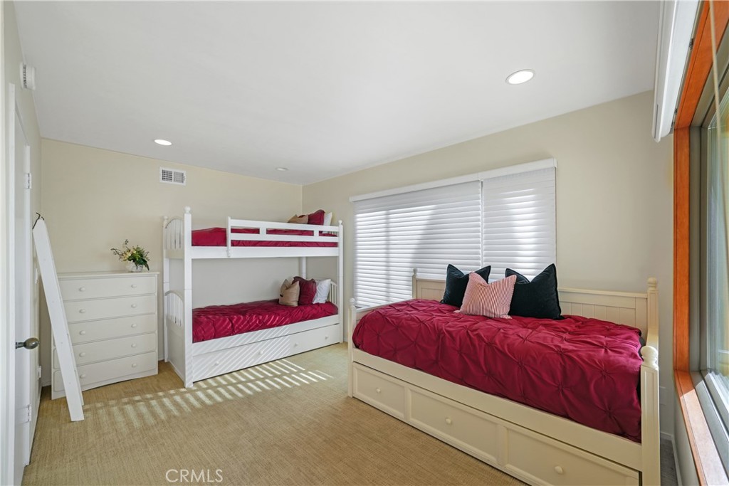 72-B Surfside Avenue Surfside, CA 90743 - Photo 44 of 56 a bedroom with a bed and window