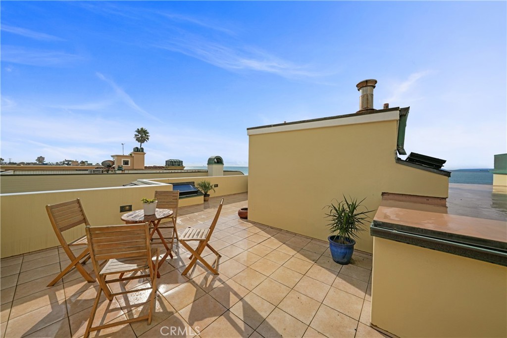 72-B Surfside Avenue Surfside, CA 90743 - Photo 47 of 56 a view of a terrace with furniture and stove