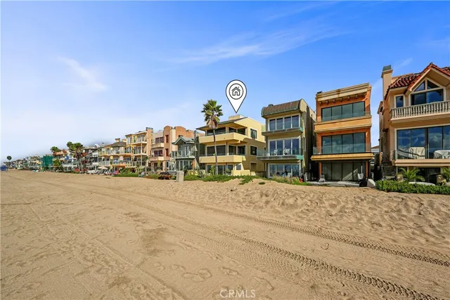 front view of a brick house with a yard