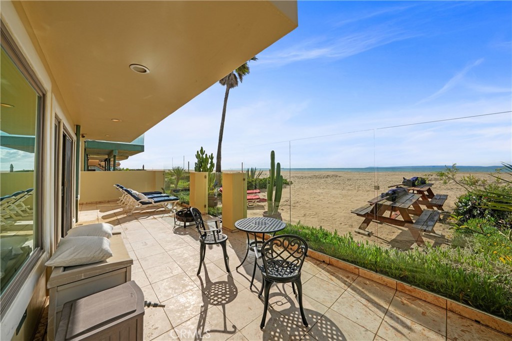72-B Surfside Avenue Surfside, CA 90743 - Photo 8 of 56 a view of a balcony with chairs and a table