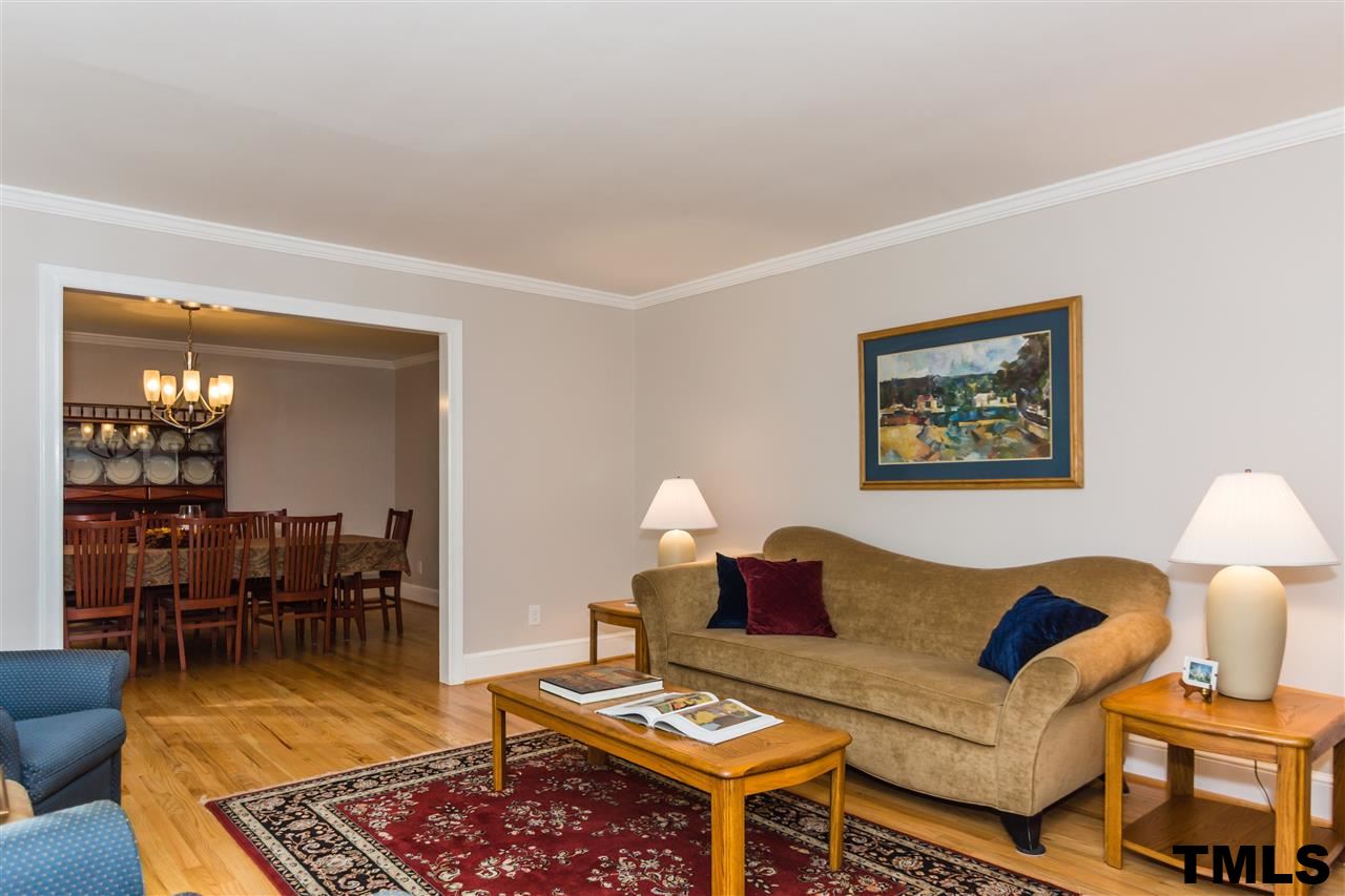 912 Queensferry Road Cary, NC 27511 - Photo 2 of 25 Living room off of foyer with refinished hardwoods.