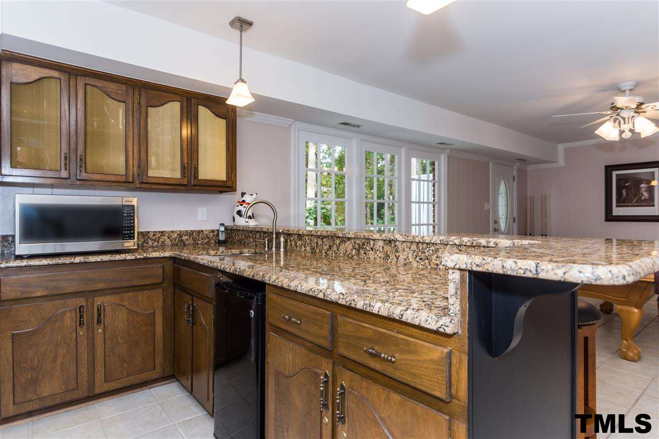 912 Queensferry Road Cary, NC 27511 - Photo 21 of 25 Very cool bonus/rec room. Play a game of pool or make room flat screen and endless entertainment.