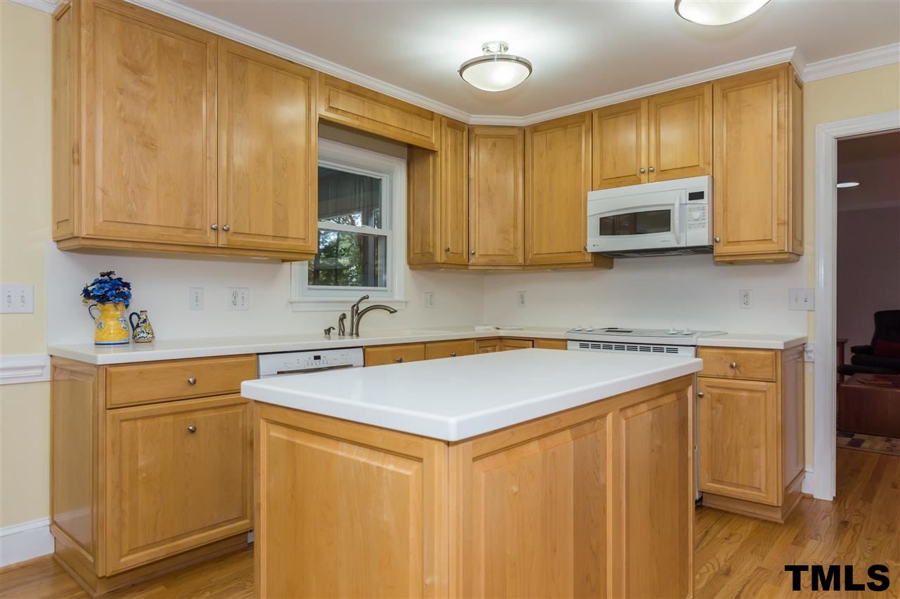 912 Queensferry Road Cary, NC 27511 - Photo 5 of 25 Large kitchen features Avonite countertops with breakfast room.