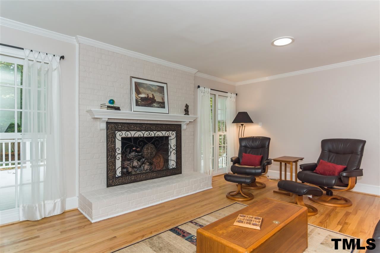 912 Queensferry Road Cary, NC 27511 - Photo 9 of 25 Cozy family room off kitchen. Gas logs and refinished hardwoods.