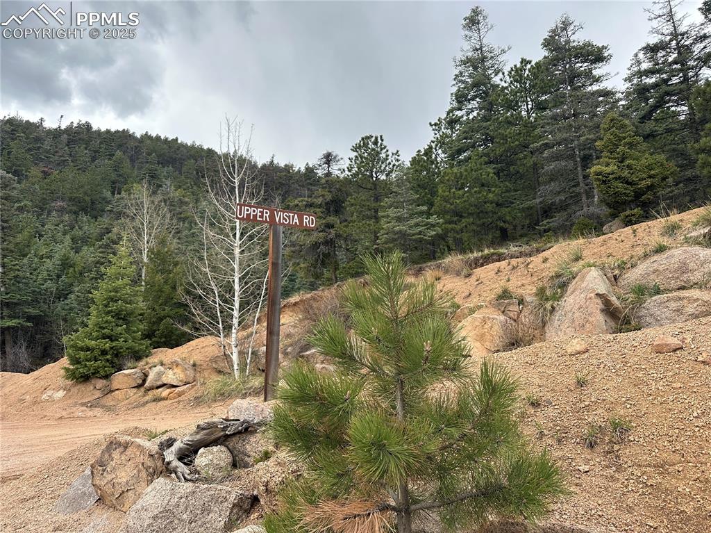 275 Upper Vista Road Manitou Springs, CO 80829 - Photo 14 of 20 a view of a small yard with wooden fence
