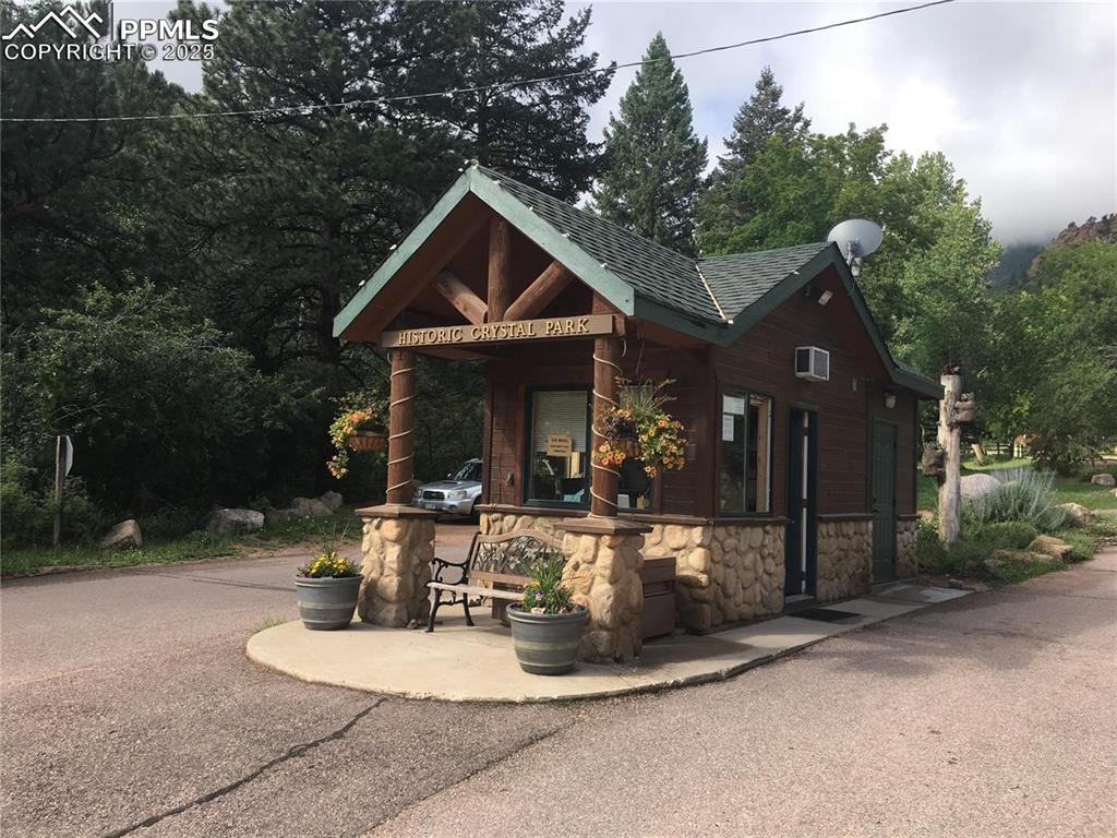 275 Upper Vista Road Manitou Springs, CO 80829 - Photo 19 of 20 a front view of a house with sitting area and garden
