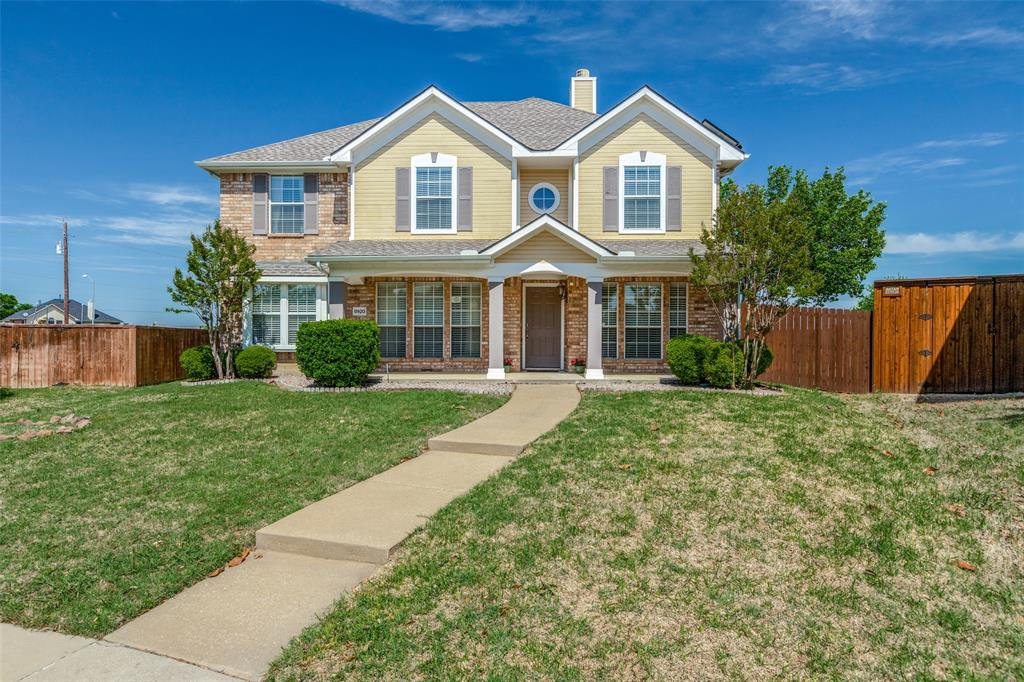 8920 Palacios Cove Plano, TX 75025 - Photo 1 of 1 a front view of a house with yard and green space