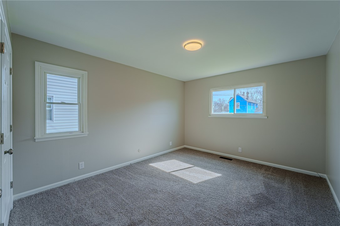 1005 Burt Street Springfield, OH 45505 - Photo 22 of 33 This inviting bedroom offers soft carpeting and ample natural light, perfect for restful living.