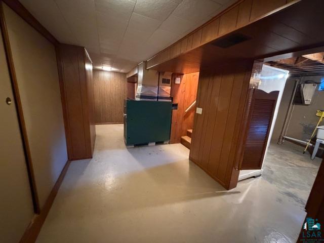 50 Beech Circle Babbitt, MN 55706 - Photo 19 of 24 Finished lower level space featuring wood-paneled walls and a painted concrete floor