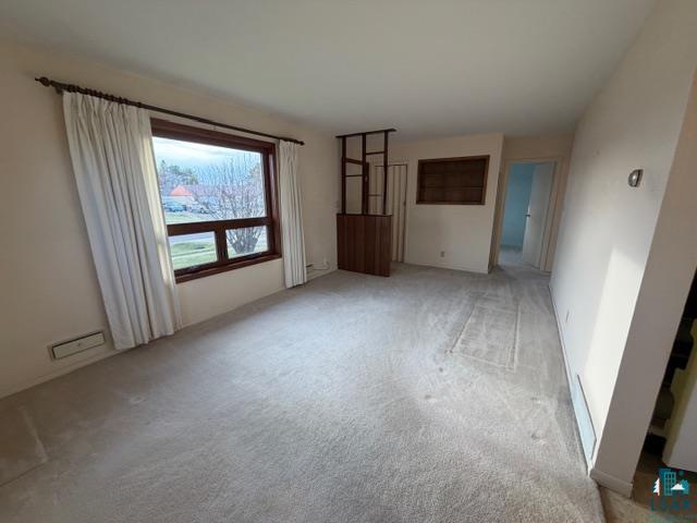 50 Beech Circle Babbitt, MN 55706 - Photo 6 of 24 Spacious interior room featuring light-colored carpeting and neutral wall tones