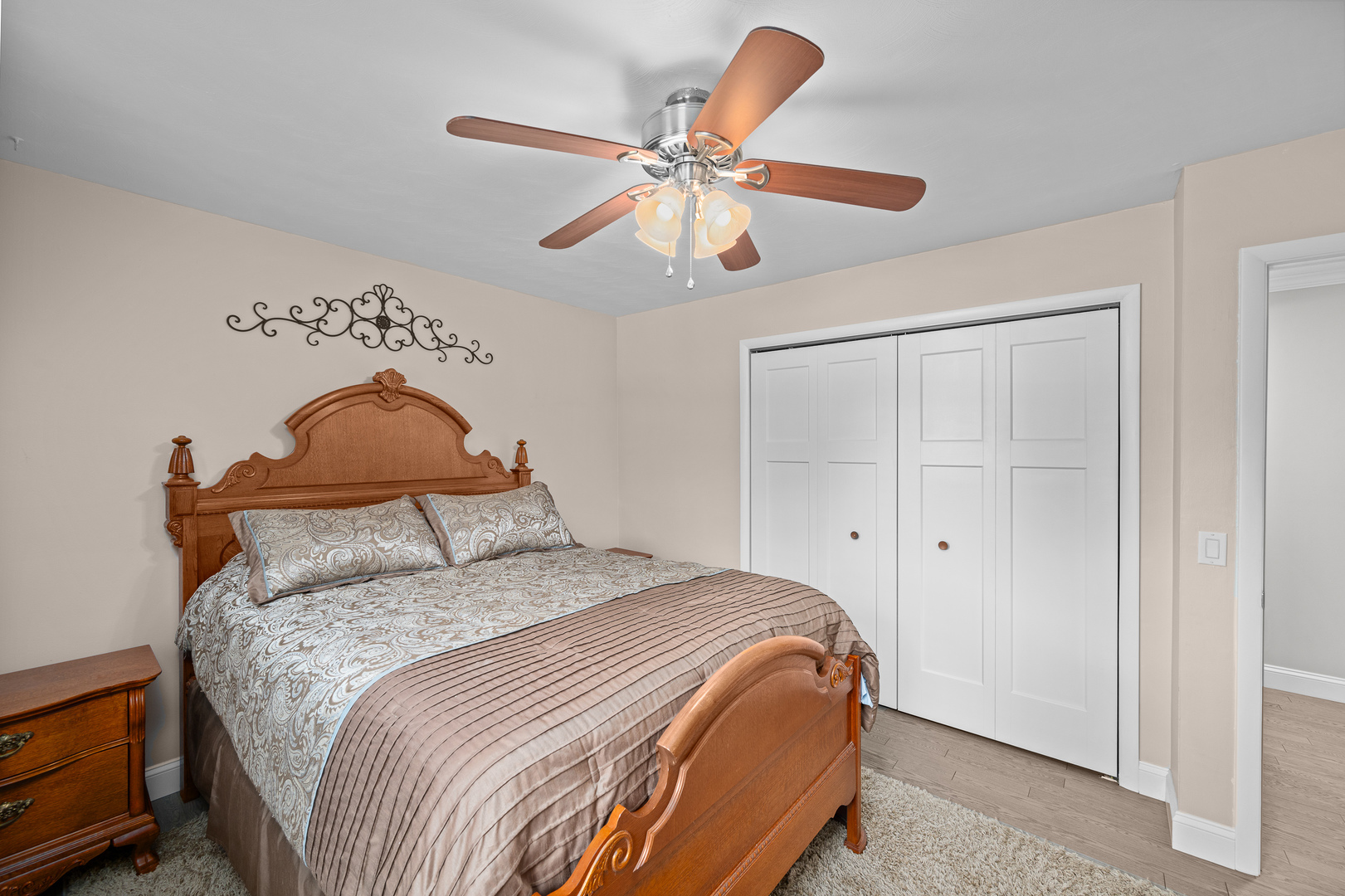 506 Bush Street Reynolds, IL 61279 - Photo 17 of 37 a bedroom with a bed and a chandelier