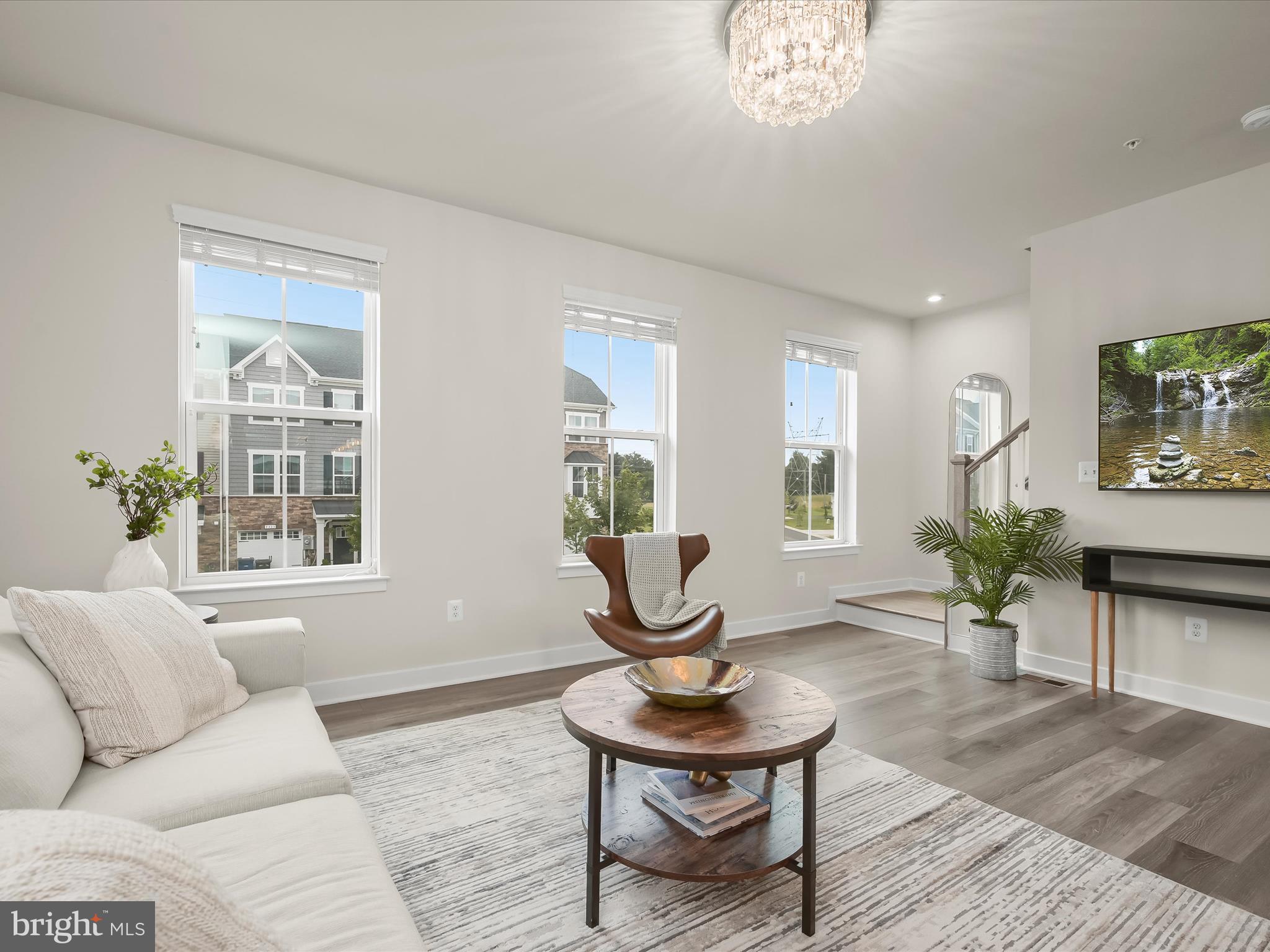 7330 Isabella Road Laurel, MD 20723 - Photo 16 of 47 a living room with furniture a window and a potted plant