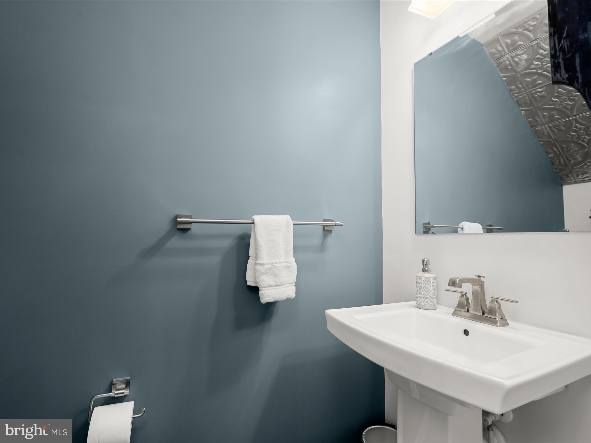 7330 Isabella Road Laurel, MD 20723 - Photo 18 of 47 a bathroom with a sink and a mirror