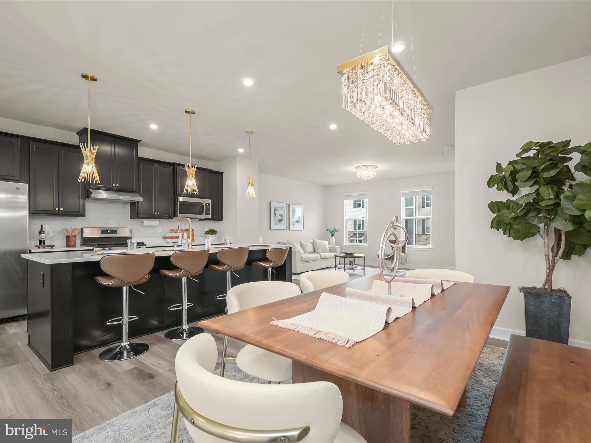 7330 Isabella Road Laurel, MD 20723 - Photo 2 of 47 a dining room with stainless steel appliances kitchen island granite countertop a dining table chairs and a kitchen view
