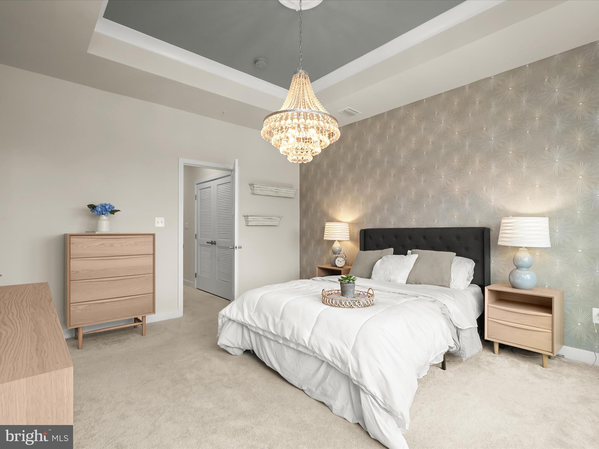 7330 Isabella Road Laurel, MD 20723 - Photo 21 of 47 a bedroom with bed and a chandelier