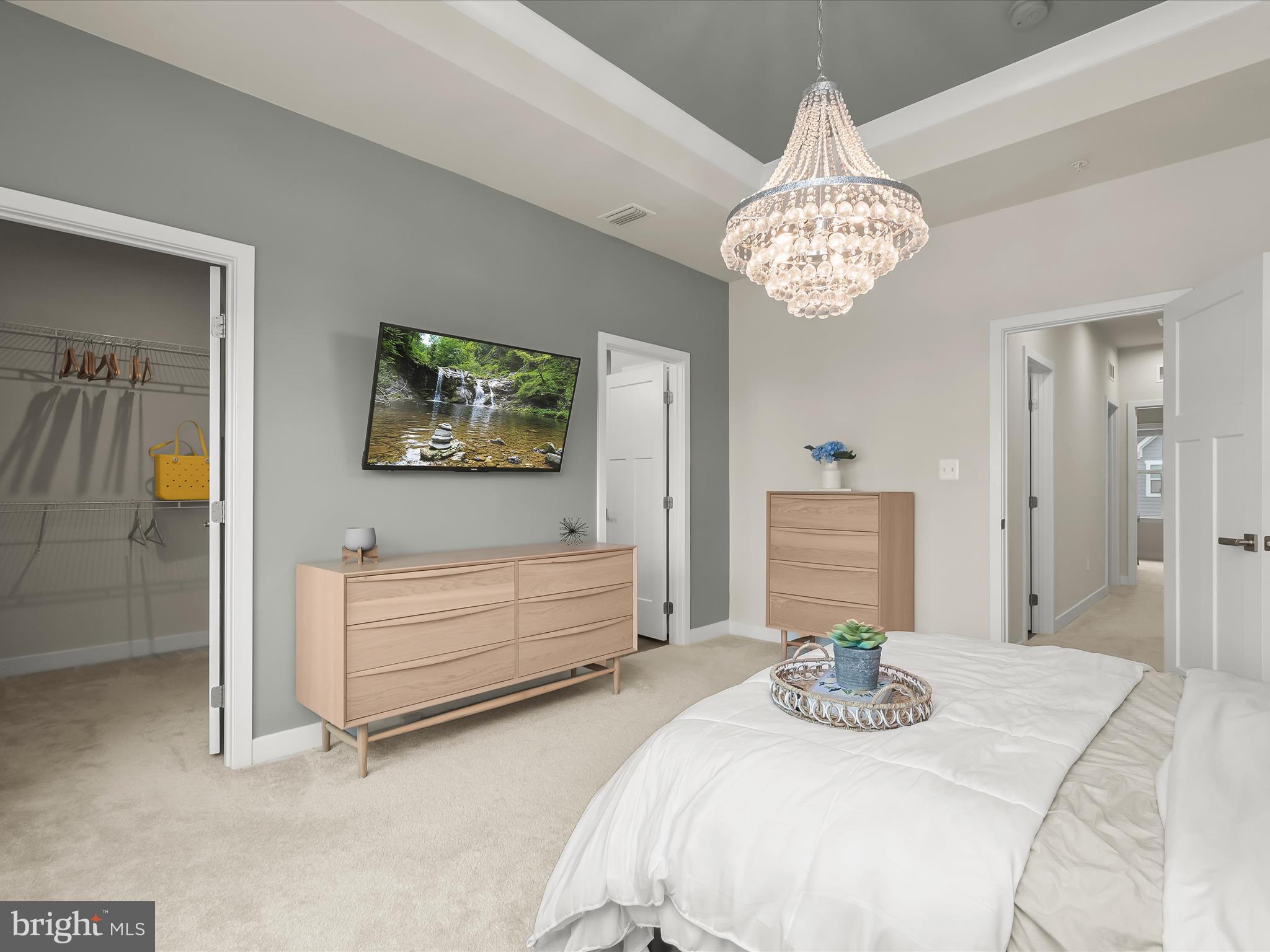 7330 Isabella Road Laurel, MD 20723 - Photo 22 of 47 a bedroom with a bed and a chandelier