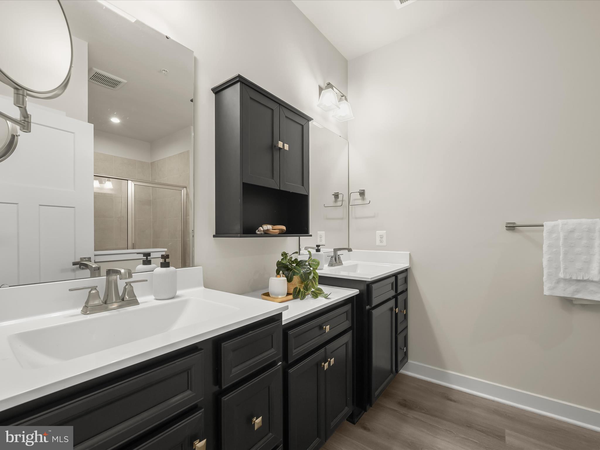 7330 Isabella Road Laurel, MD 20723 - Photo 23 of 47 a bathroom with a double vanity sink and a mirror
