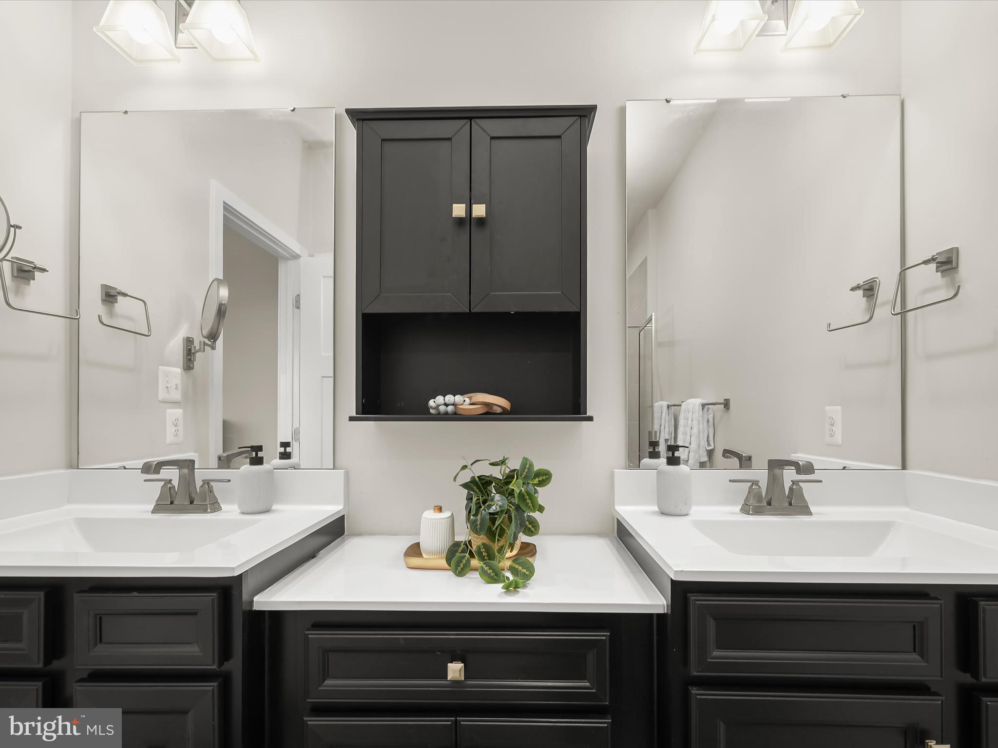 7330 Isabella Road Laurel, MD 20723 - Photo 24 of 47 a bathroom with a sink double vanity and a mirror