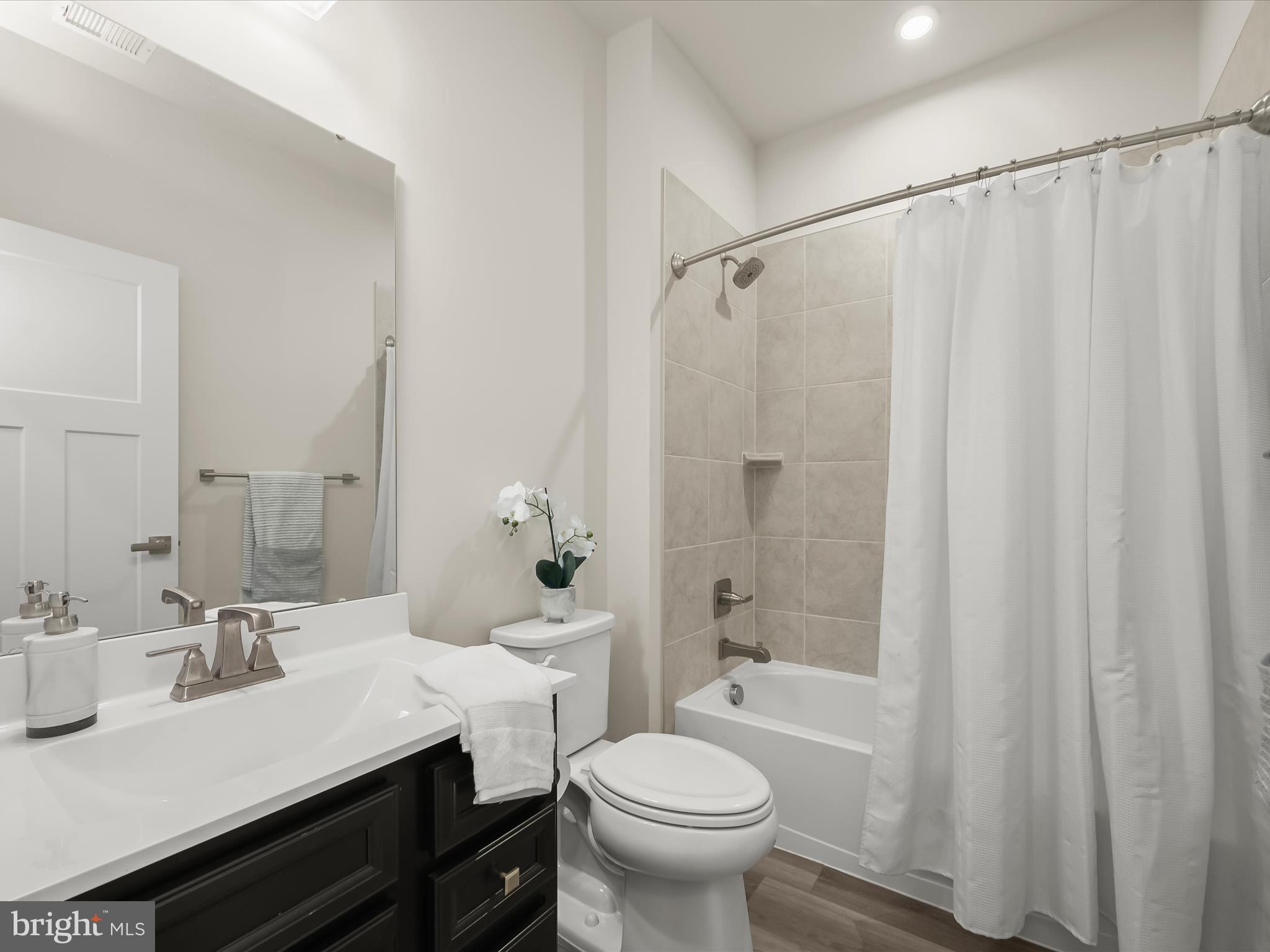 7330 Isabella Road Laurel, MD 20723 - Photo 28 of 47 a bathroom with a sink and a mirror