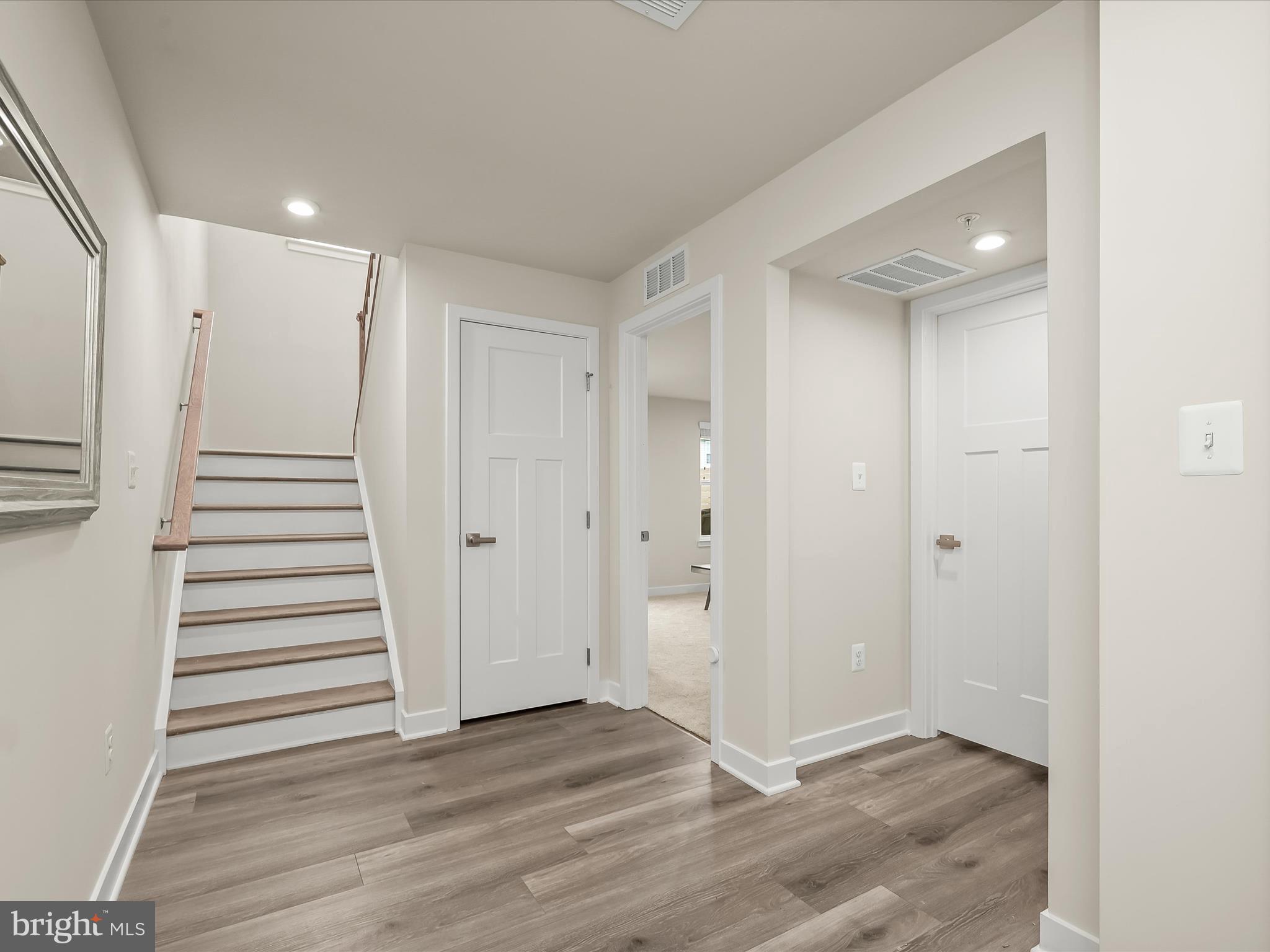 7330 Isabella Road Laurel, MD 20723 - Photo 31 of 47 a view of a hallway with wooden floor