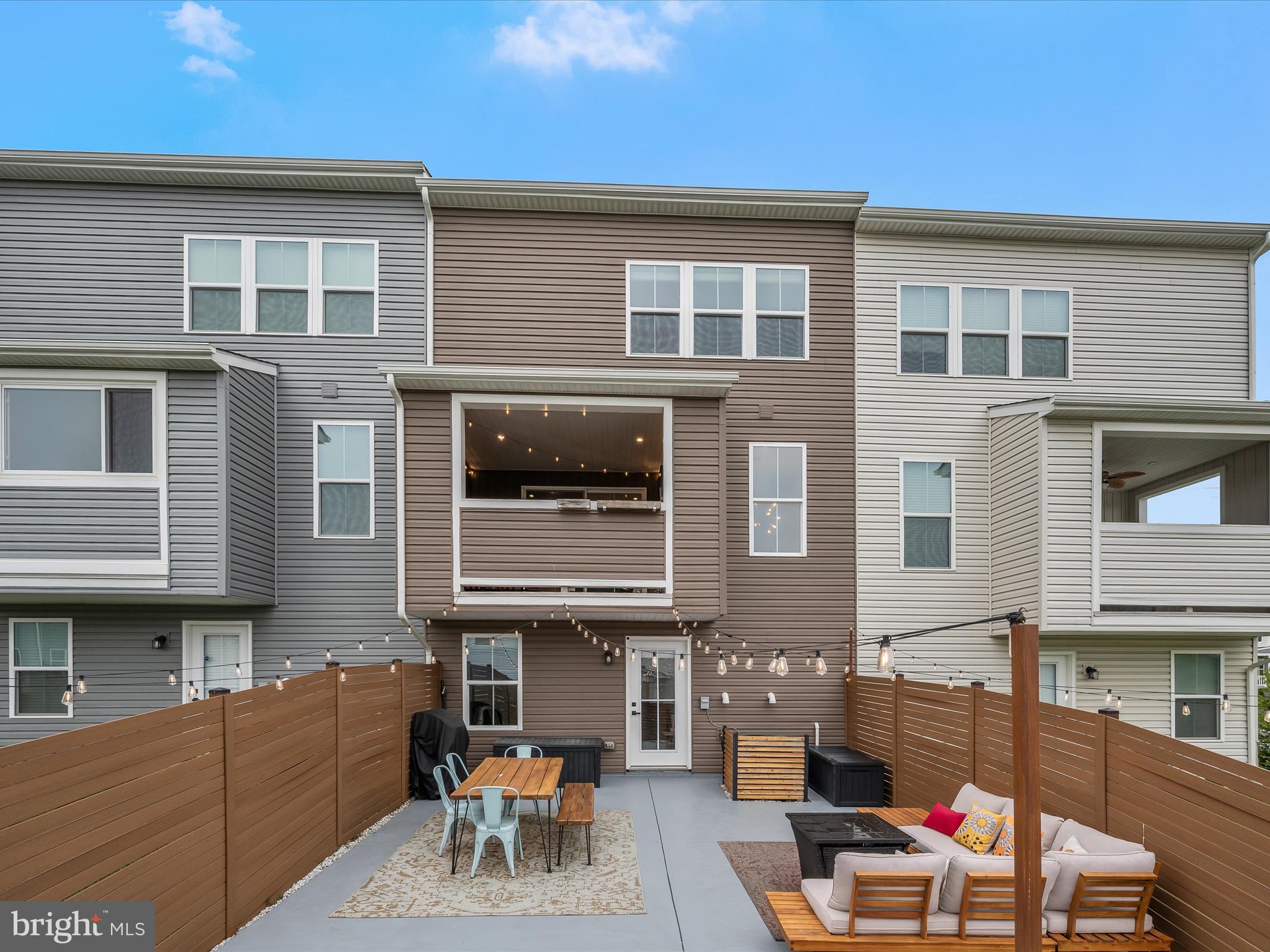 7330 Isabella Road Laurel, MD 20723 - Photo 40 of 47 a view of a building with a table and chairs