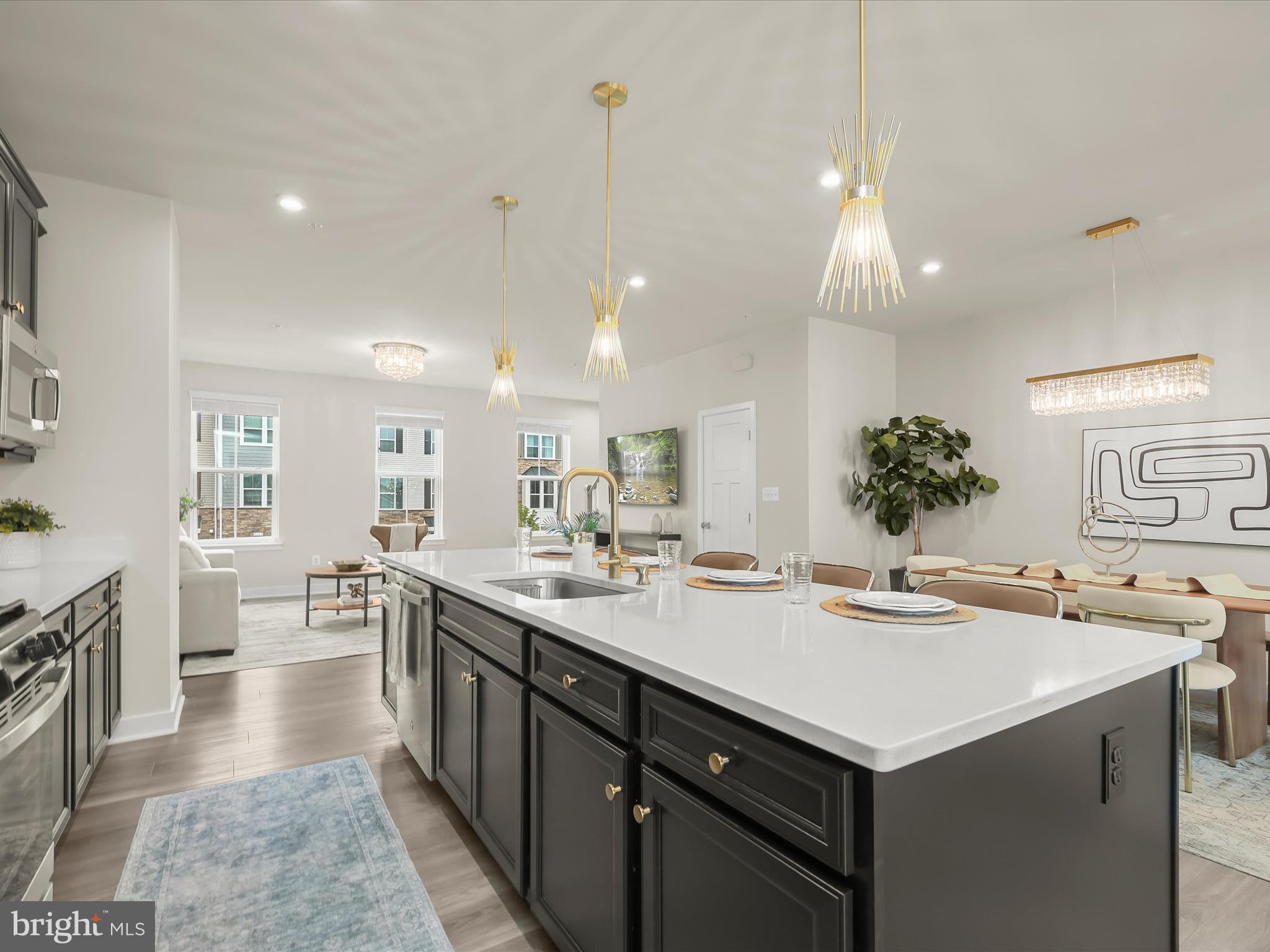 7330 Isabella Road Laurel, MD 20723 - Photo 7 of 47 a kitchen with sink stove and cabinets