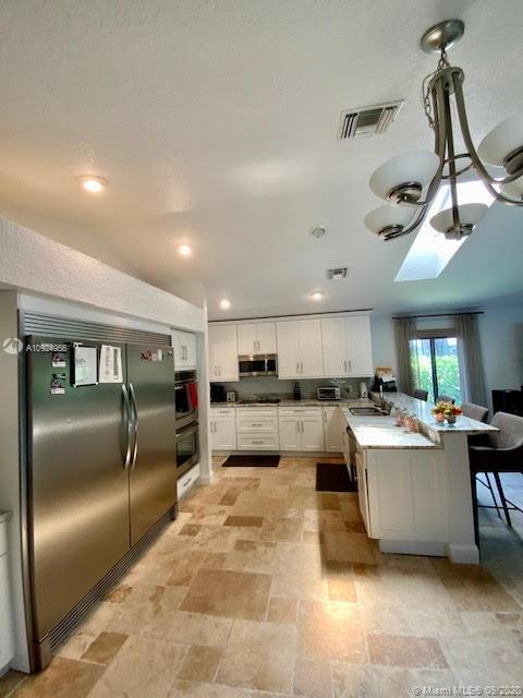 19715 Sedgefield Terrace Boca Raton, FL 33498 - Photo 7 of 43 Full Kitchen and break fast bar