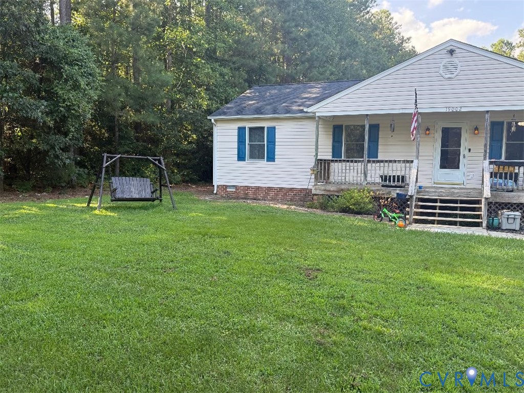 19002 Brandon Road Spring Grove, VA 23881 - Photo 3 of 3 View of front facade with a porch, a front lawn, c