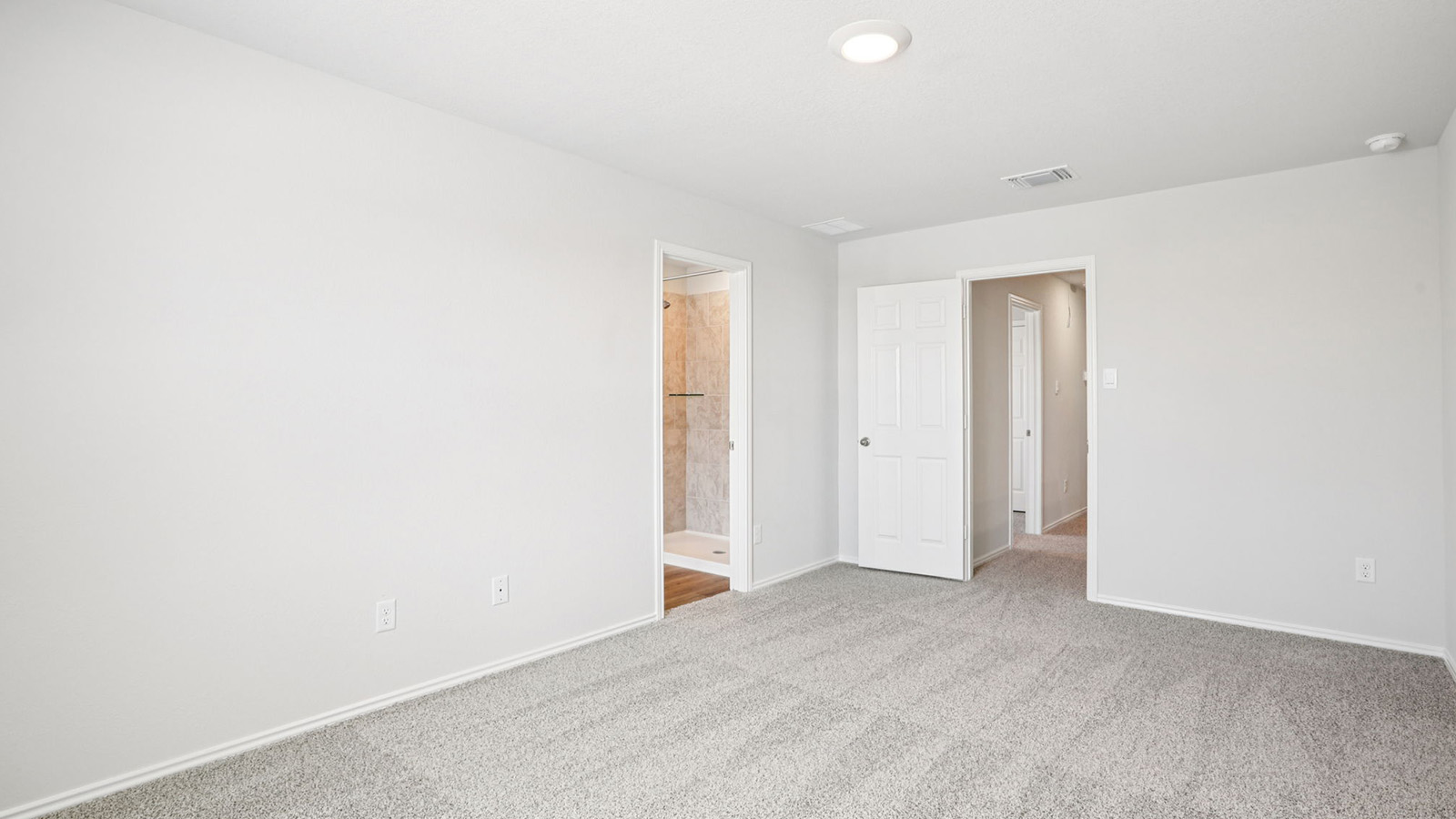 133 Wyatt Way Jarrell, TX 76537 - Photo 15 of 32 Spacious interior room featuring light gray carpeting and neutral wall tones