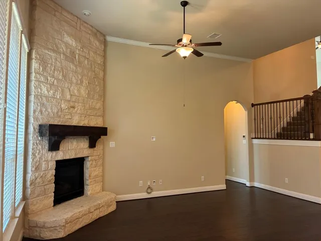 an empty room with a fireplace