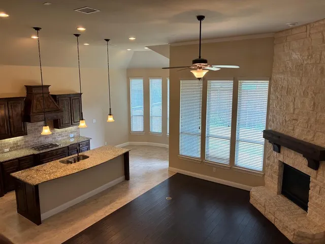 a living room with furniture fireplace and flat screen tv