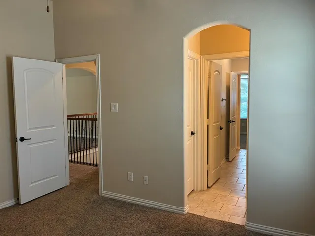 an empty room with closet area