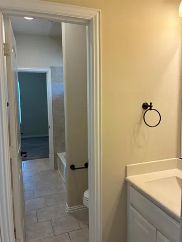 a bathroom with a sink and mirror