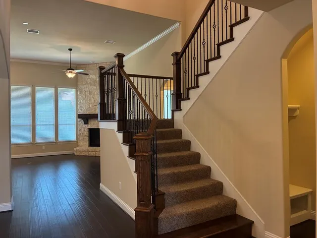 a view of entryway and hall with wooden floor