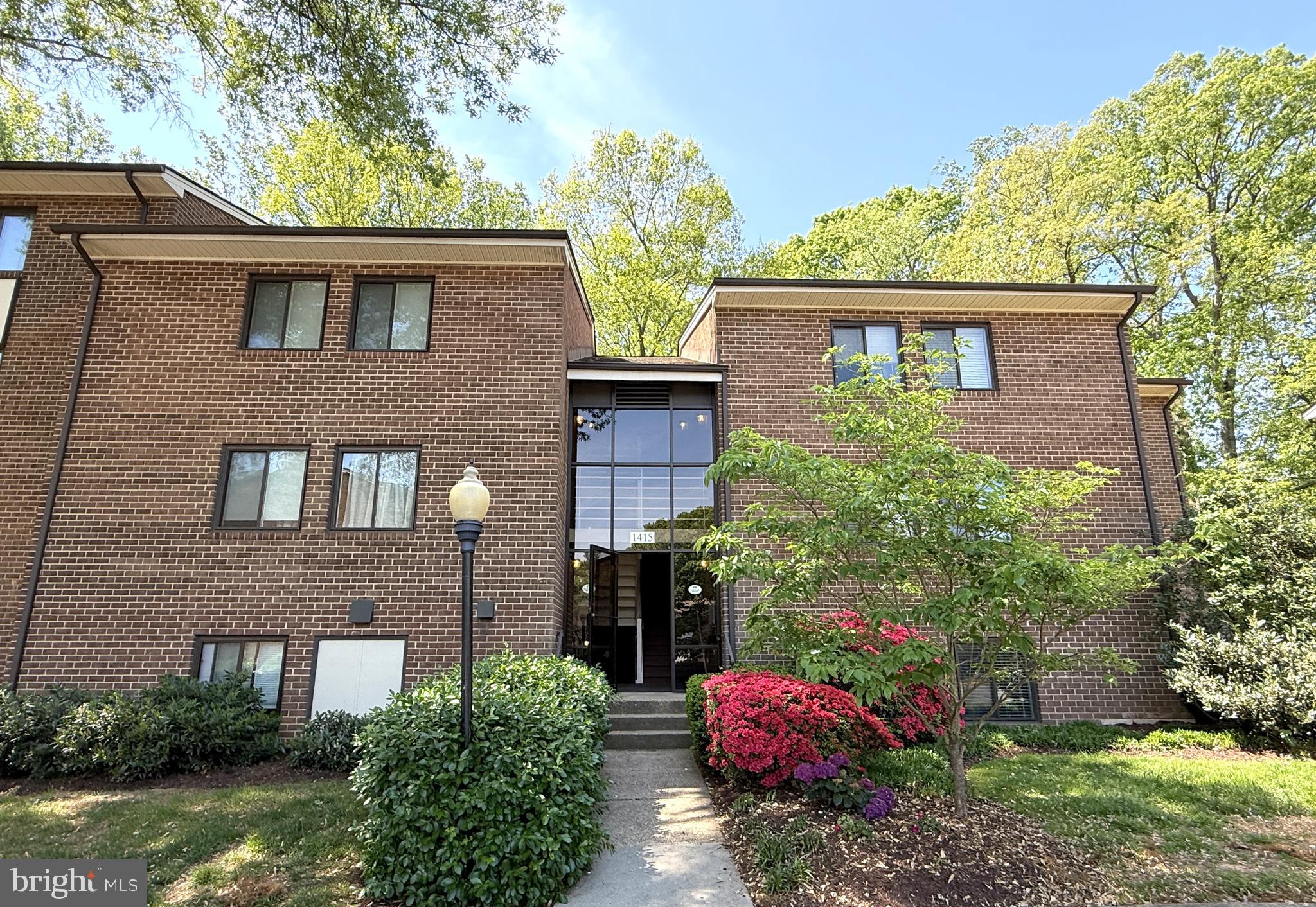 1415 Northgate Square, Unit 15/21B Reston, VA 20190 - Photo 1 of 28 a front view of a house with garden