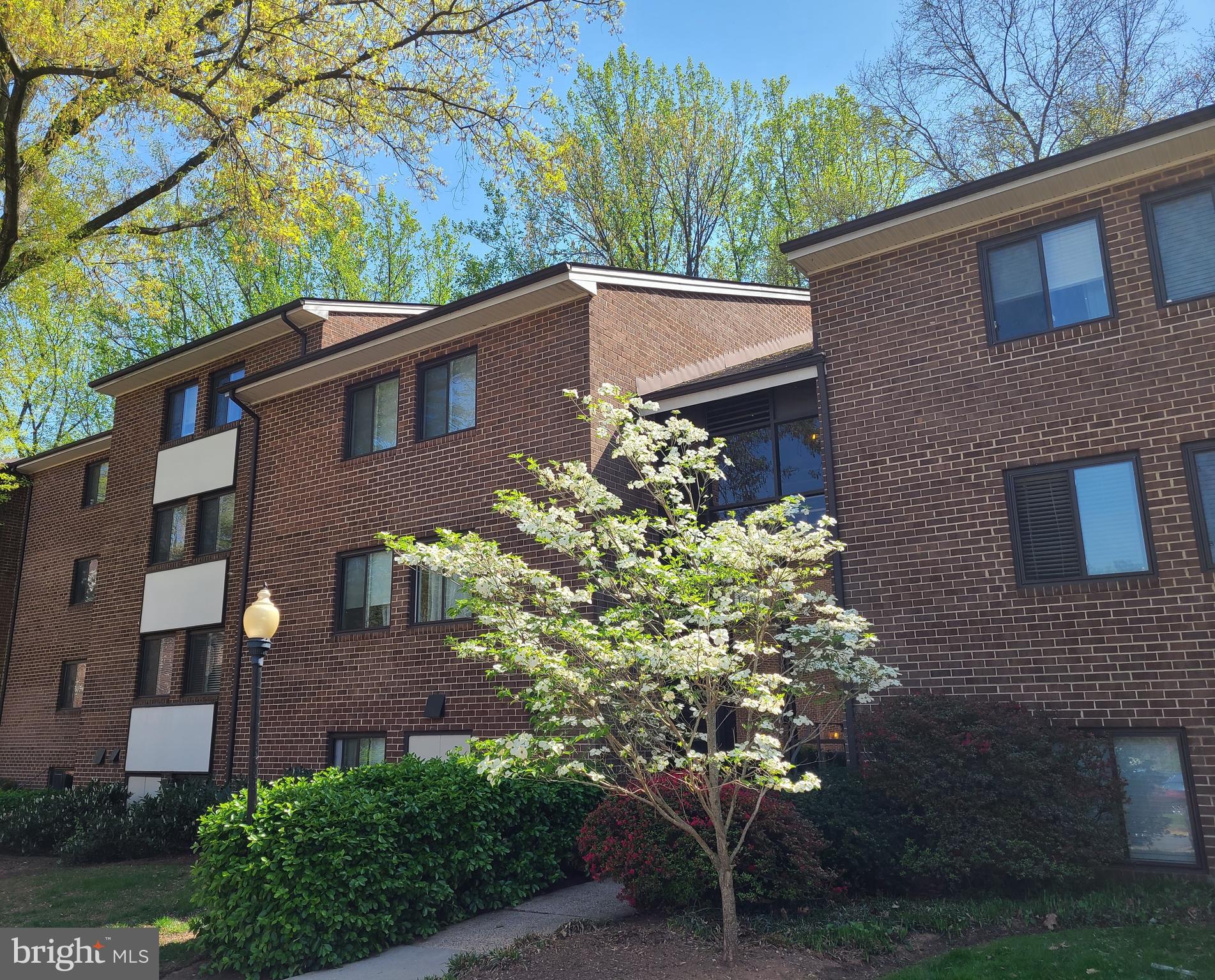 1415 Northgate Square, Unit 15/21B Reston, VA 20190 - Photo 28 of 28 a front view of a house with garden
