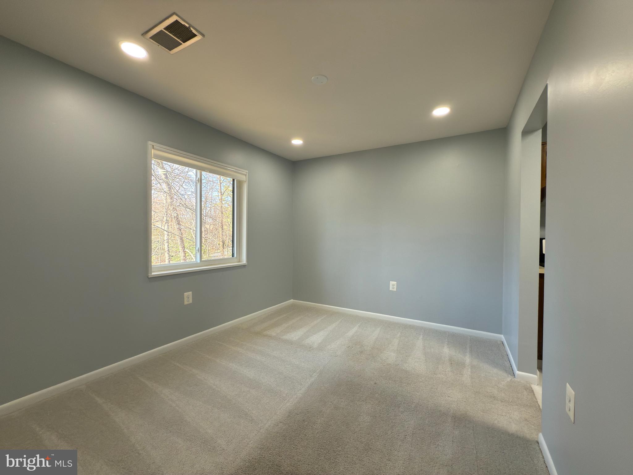 1415 Northgate Square, Unit 15/21B Reston, VA 20190 - Photo 8 of 28 an empty room with windows