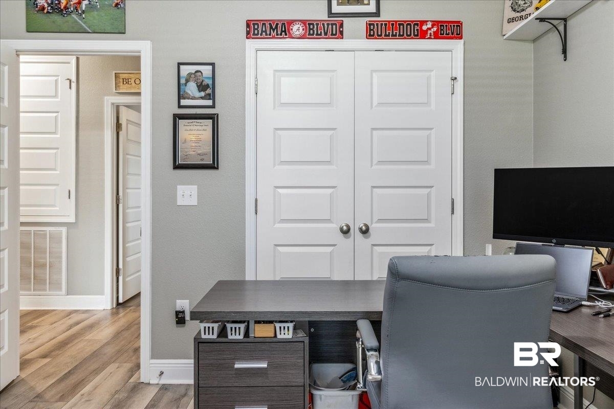 7022 Rocky Rd Loop Gulf Shores, AL 36542 - Photo 37 of 59 Office with light wood-style flooring and baseboards