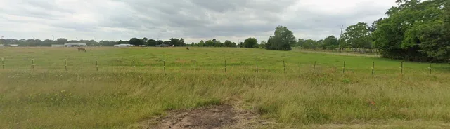a view of a lake with a big yard