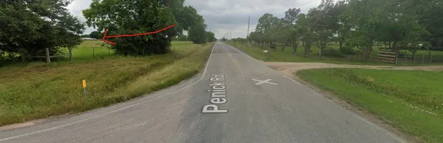 a view of a street with a park