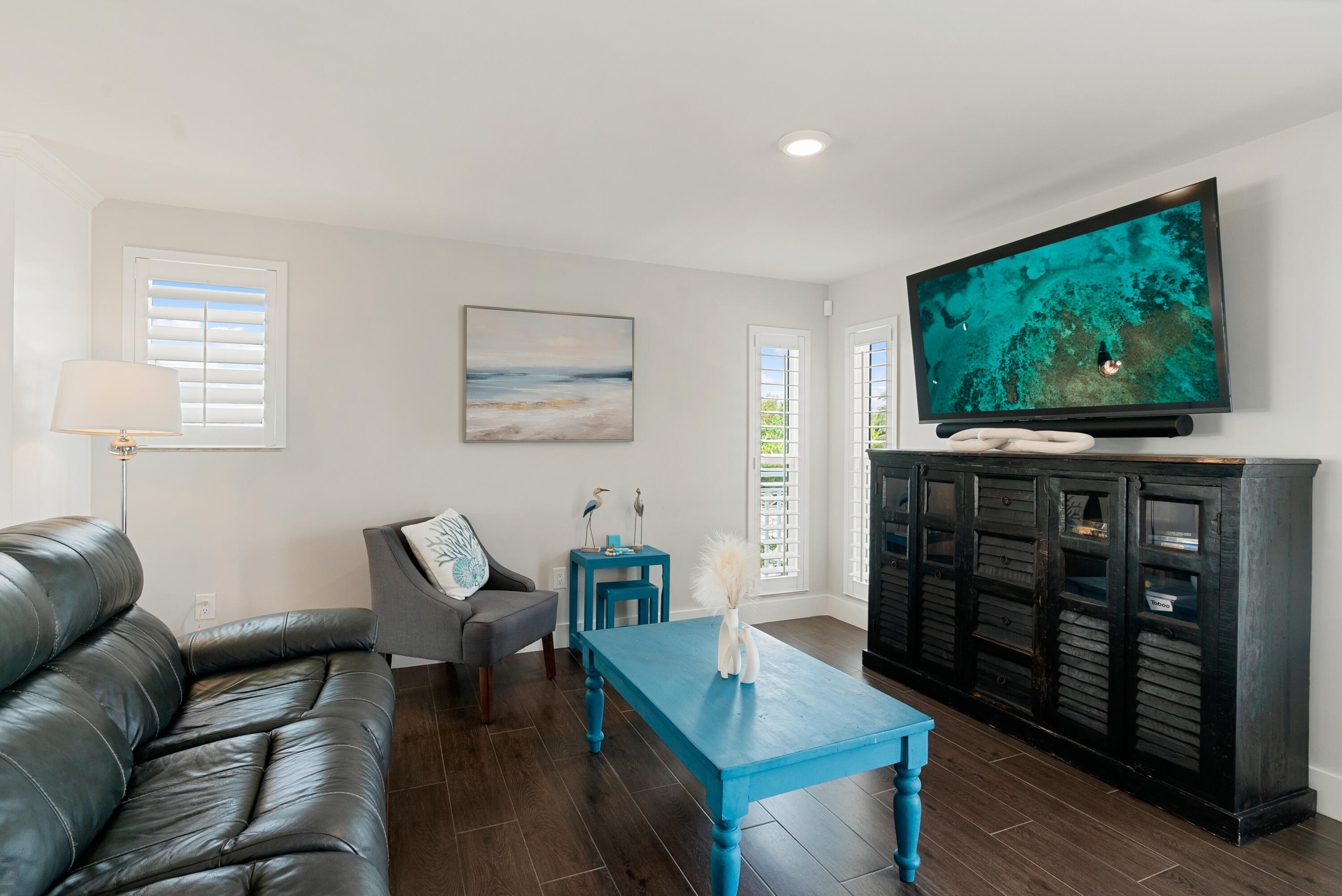 215 Wildwood Circle Key Largo, FL 33037 - Photo 12 of 61 a living room with furniture and a flat screen tv