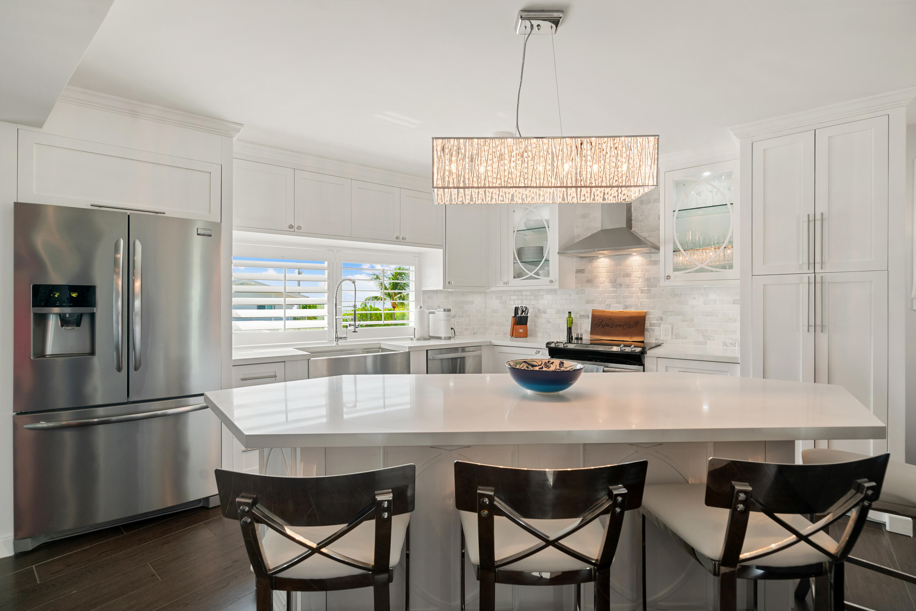215 Wildwood Circle Key Largo, FL 33037 - Photo 17 of 61 a kitchen with stainless steel appliances a dining table chairs and refrigerator