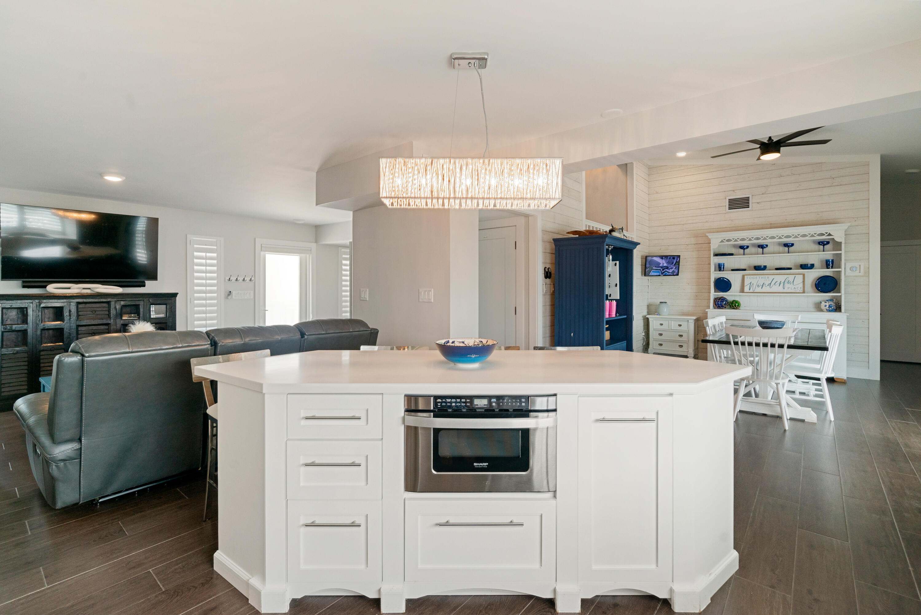 215 Wildwood Circle Key Largo, FL 33037 - Photo 19 of 61 a kitchen that has a lot of cabinets in it and wooden floors