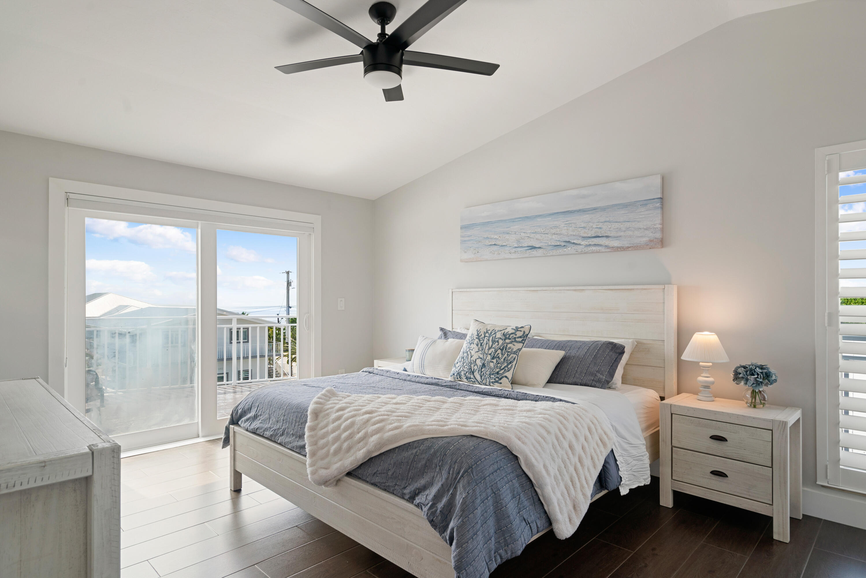215 Wildwood Circle Key Largo, FL 33037 - Photo 21 of 61 a bedroom with a bed and a window